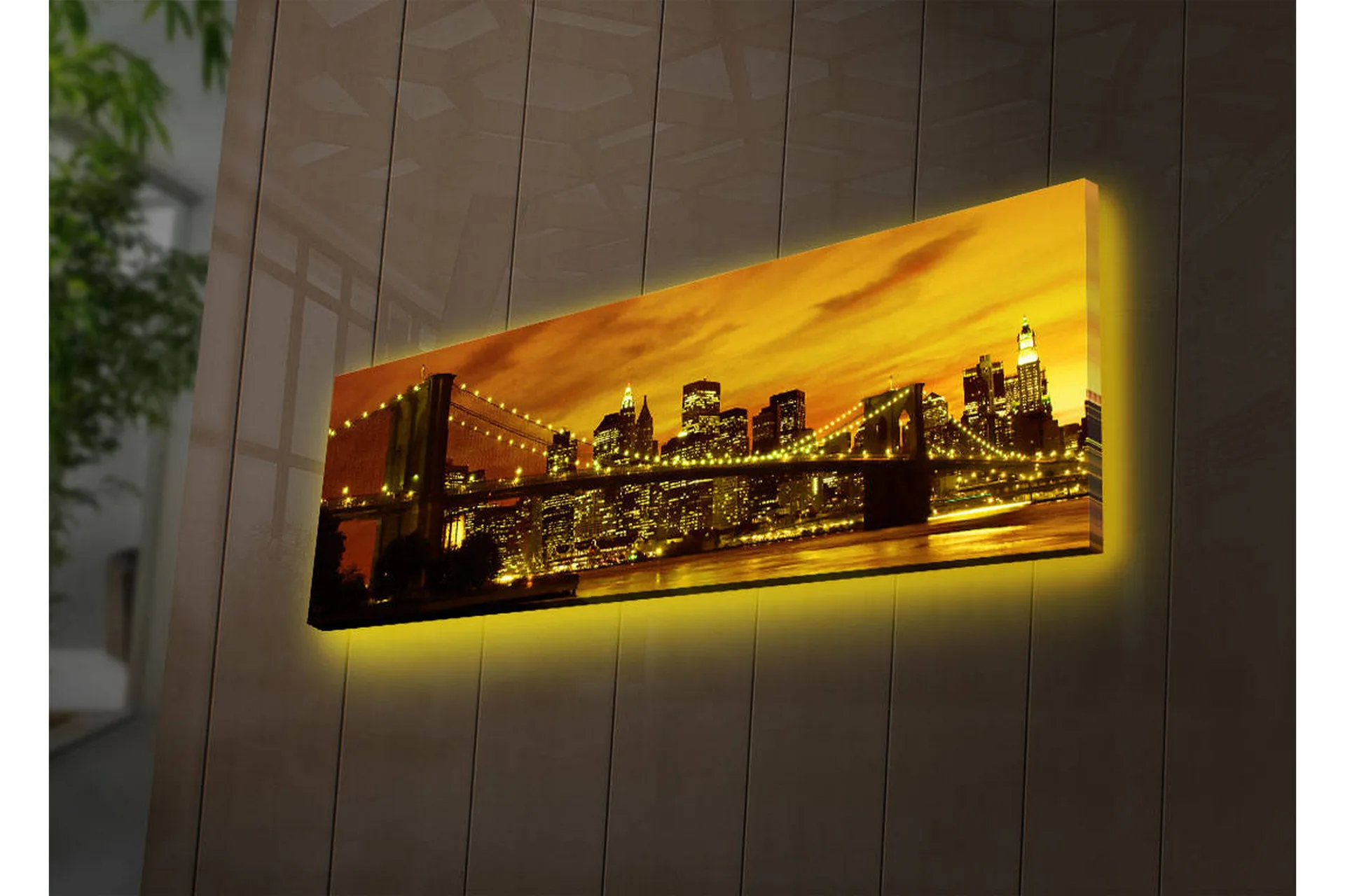 Canvastavla med LED-belysning 30x90 cm - Stadssilhuett med bro i solnedgångens gyllene ljus